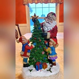 Large Christmas Santa & Chidren decorating the Tree, lights up, plays music